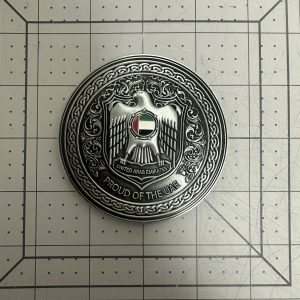 Custom challenge coin with antique silver plating and UAE falcon emblem