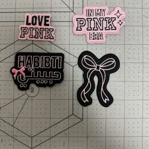Small custom embroidered slogan patches with die-cut borders
