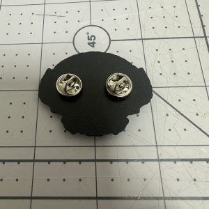 Reverse of a custom enamel pin showing the butterfly clutch fittings